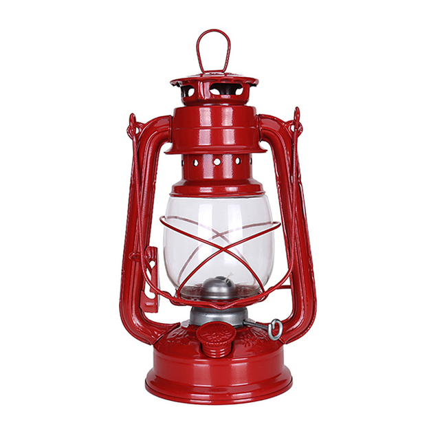 La lampe à kérosène de face, sur fond blanc, et en variante couleur rouge