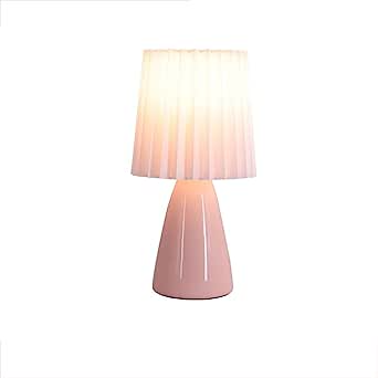 le produit Lampe plissée vu de face sur un fond blanc, produit allumé et couleur du produit rose